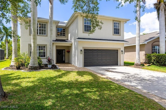 view of front of property with stucco siding, driveway, a garage, a front yard, and central AC unit