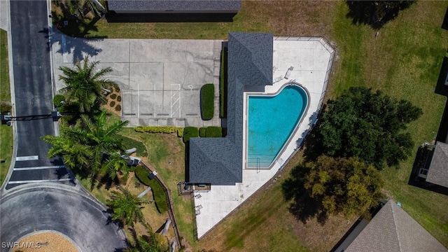 aerial view of property and surrounding area with a pool