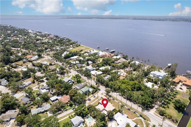 drone / aerial view featuring a residential view and a water view