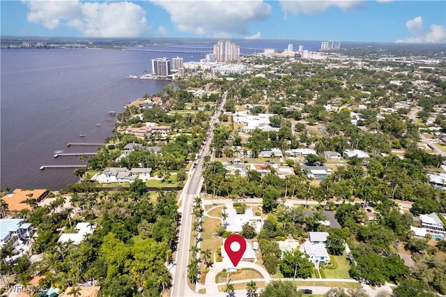 bird's eye view featuring a water view and a city view