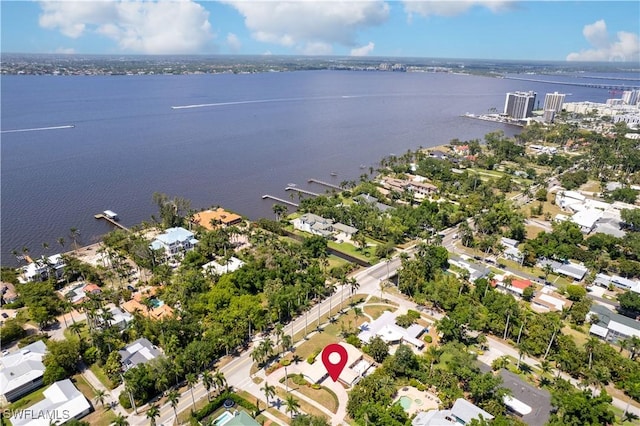 birds eye view of property with a residential view and a water view