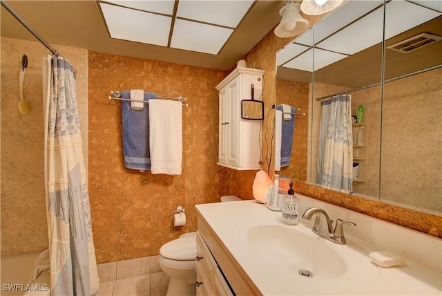 full bath with visible vents, toilet, shower / bathtub combination with curtain, vanity, and tile patterned flooring
