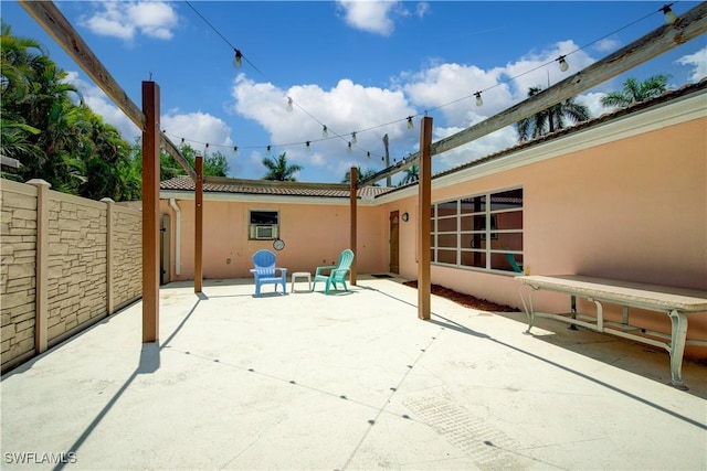 view of patio / terrace featuring fence