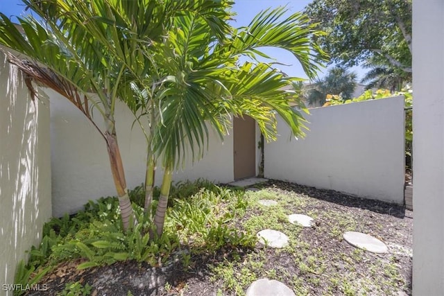 576 Retreat Dr Unit 101, Naples, FL 34110 - view of yard featuring fence