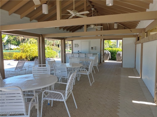 576 Retreat Dr Unit 101, Naples, FL 34110 - view of patio / terrace with a gazebo, outdoor dining area, and ceiling fan