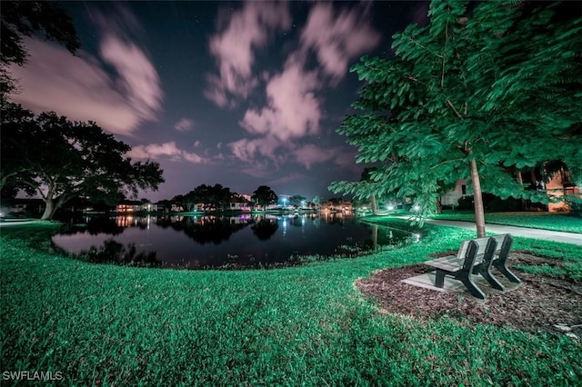 576 Retreat Dr Unit 101, Naples, FL 34110 - view of yard with a water view