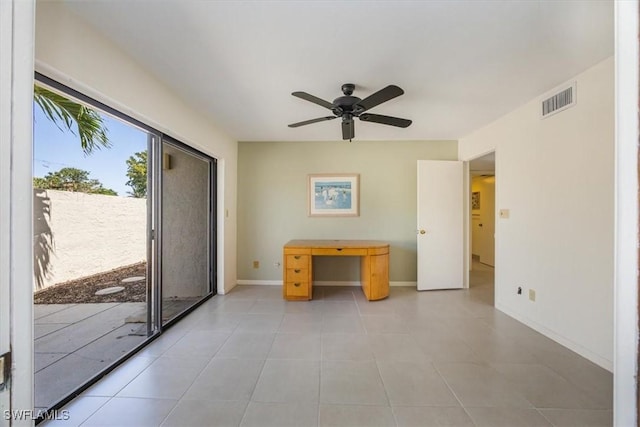576 Retreat Dr Unit 101, Naples, FL 34110 - interior space featuring visible vents, baseboards, a ceiling fan, and light tile patterned floors