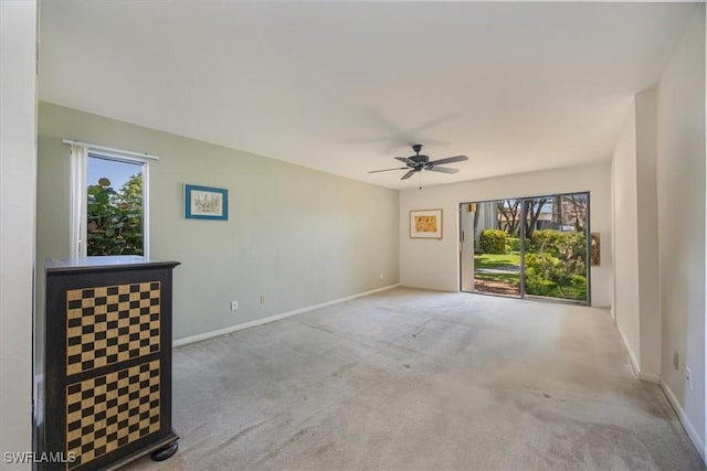 576 Retreat Dr Unit 101, Naples, FL 34110 - unfurnished room with carpet floors, ceiling fan, and baseboards