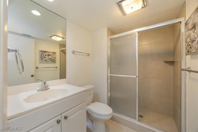 576 Retreat Dr Unit 101, Naples, FL 34110 - bathroom featuring recessed lighting, toilet, vanity, and a stall shower