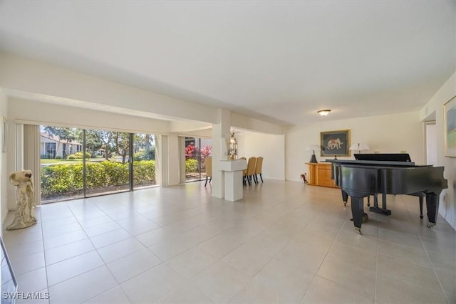576 Retreat Dr Unit 101, Naples, FL 34110 - living area featuring light tile patterned flooring
