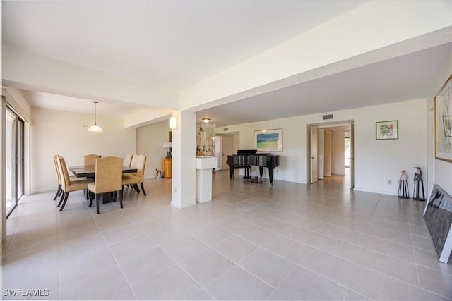 576 Retreat Dr Unit 101, Naples, FL 34110 - dining area with visible vents and light tile patterned flooring
