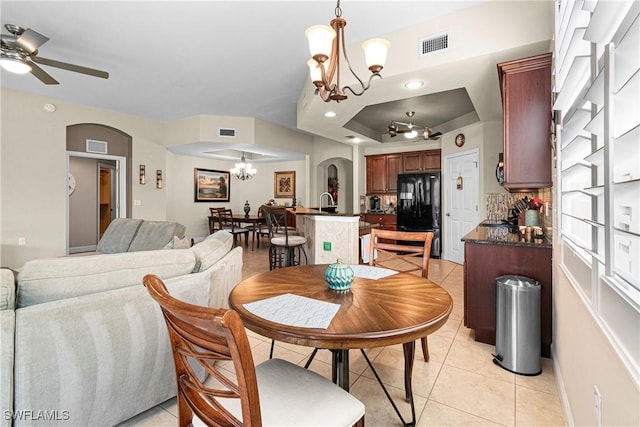 10637 Pelican Preserve Blvd Unit A, Fort Myers, FL 33913 - dining area featuring visible vents, arched walkways, ceiling fan with notable chandelier, and light tile patterned floors
