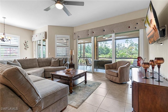 10637 Pelican Preserve Blvd Unit A, Fort Myers, FL 33913 - living area featuring ceiling fan with notable chandelier and light tile patterned floors