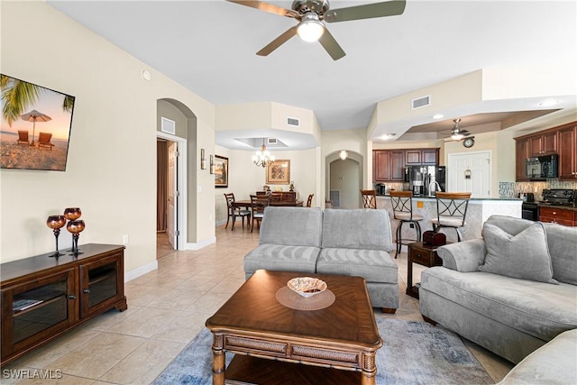 10637 Pelican Preserve Blvd Unit A, Fort Myers, FL 33913 - living room with arched walkways, a ceiling fan, visible vents, and light tile patterned flooring