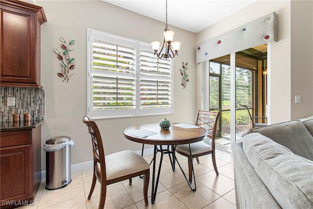 10637 Pelican Preserve Blvd Unit A, Fort Myers, FL 33913 - dining space with an inviting chandelier, baseboards, plenty of natural light, and light tile patterned flooring