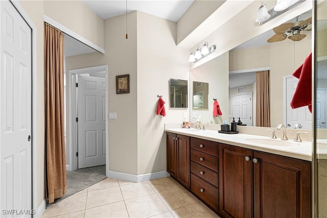 10637 Pelican Preserve Blvd Unit A, Fort Myers, FL 33913 - full bathroom featuring double vanity, baseboards, ceiling fan, tile patterned floors, and a sink