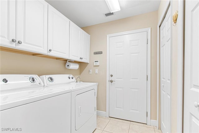 10637 Pelican Preserve Blvd Unit A, Fort Myers, FL 33913 - washroom featuring visible vents, baseboards, separate washer and dryer, cabinet space, and light tile patterned floors