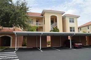exterior space featuring covered parking