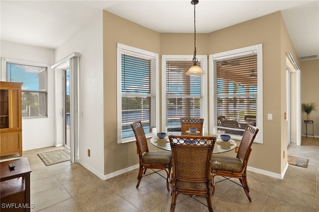 3428 SW 27th Pl, Cape Coral, FL 33914 - dining room with visible vents, a wealth of natural light, baseboards, and light tile patterned floors