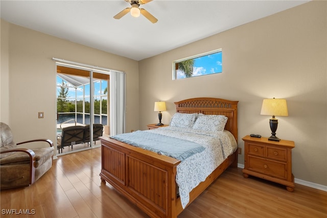 3428 SW 27th Pl, Cape Coral, FL 33914 - bedroom with access to exterior, multiple windows, and light wood finished floors