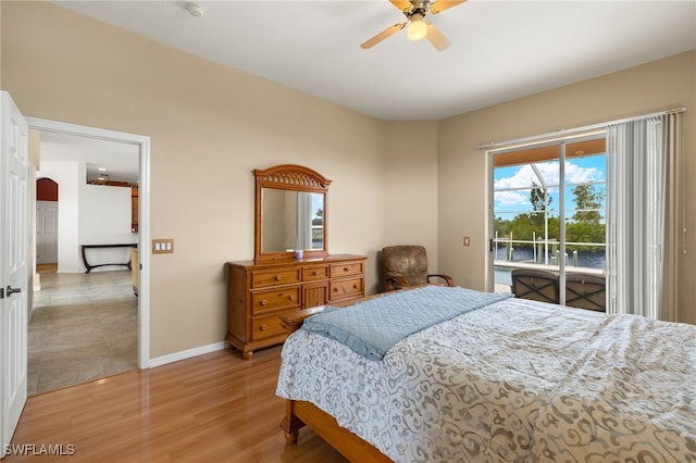 3428 SW 27th Pl, Cape Coral, FL 33914 - bedroom with access to outside, light wood-type flooring, baseboards, and a ceiling fan