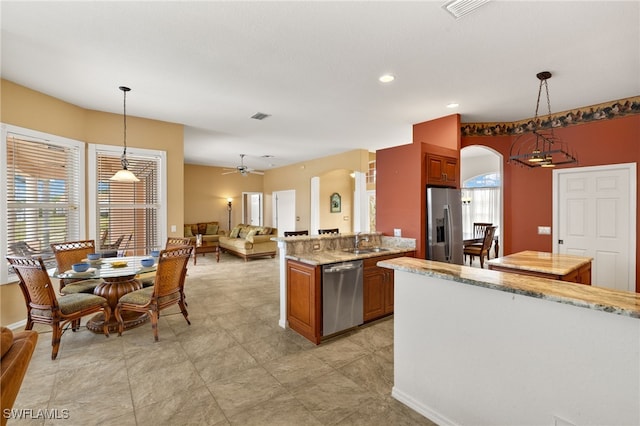 3428 SW 27th Pl, Cape Coral, FL 33914 - kitchen featuring a sink, visible vents, appliances with stainless steel finishes, and arched walkways