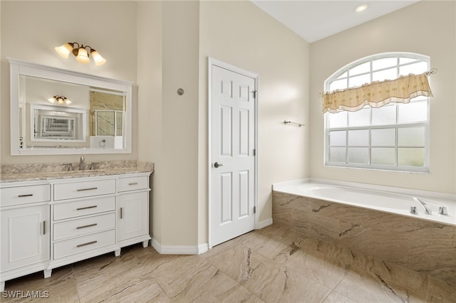 3428 SW 27th Pl, Cape Coral, FL 33914 - bathroom featuring a bath, baseboards, vanity, marble finish floor, and a stall shower