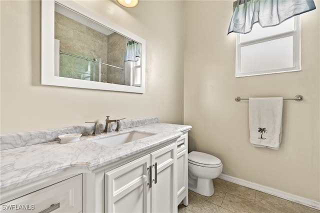 3428 SW 27th Pl, Cape Coral, FL 33914 - bathroom featuring vanity, baseboards, tile patterned floors, walk in shower, and toilet