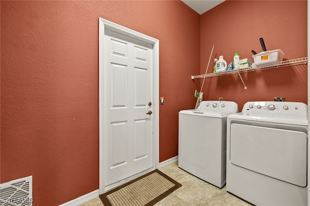 3428 SW 27th Pl, Cape Coral, FL 33914 - laundry room with washer and clothes dryer, visible vents, laundry area, and baseboards
