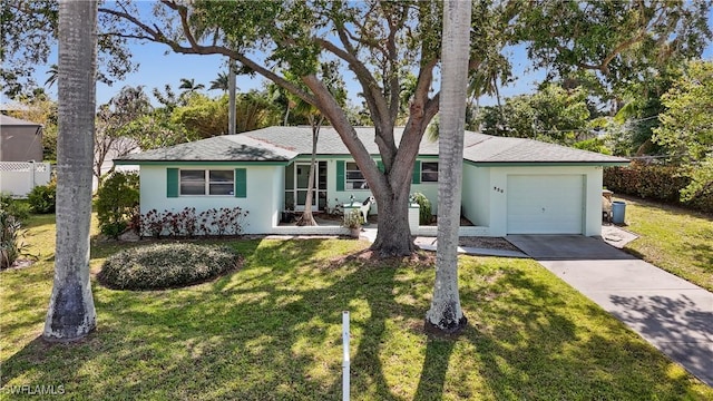 330 Oklahoma Ave, Fort Myers, FL 33905 - single story home with concrete driveway, stucco siding, an attached garage, and a front lawn