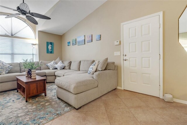 13199 Whitehaven Ln Unit 1808, Fort Myers, FL 33966 - living area with light tile patterned floors, a ceiling fan, vaulted ceiling, and baseboards