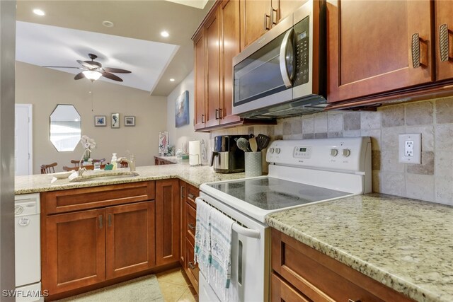 13199 Whitehaven Ln Unit 1808, Fort Myers, FL 33966 - kitchen featuring a sink, vaulted ceiling, decorative backsplash, a ceiling fan, and white appliances