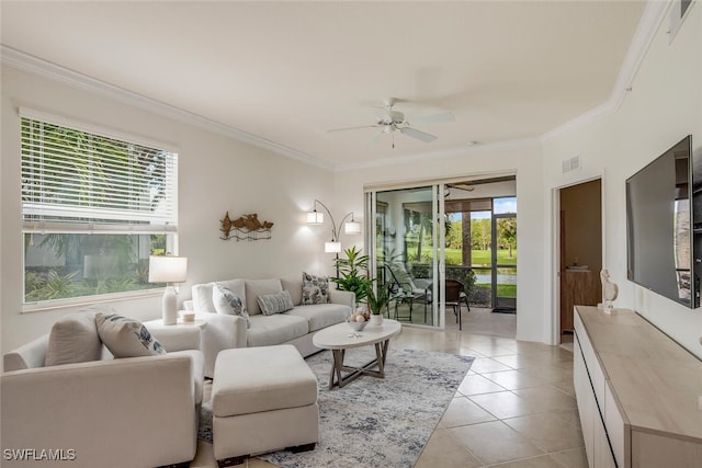living area featuring light tile patterned flooring, visible vents, crown molding, and ceiling fan