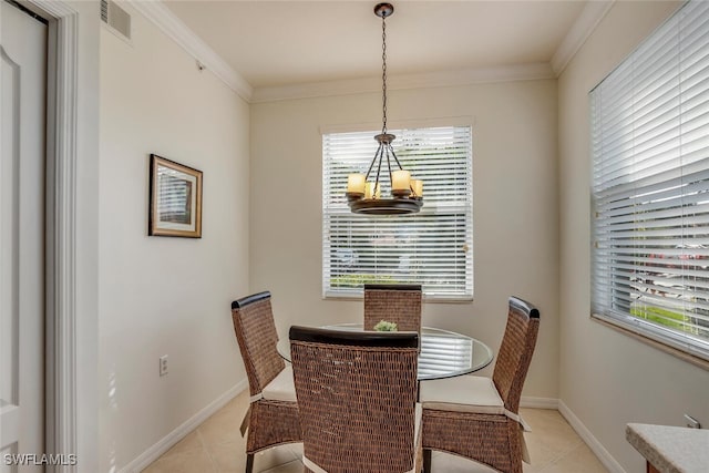 dining room with light tile patterned flooring, an inviting chandelier, ornamental molding, and visible vents