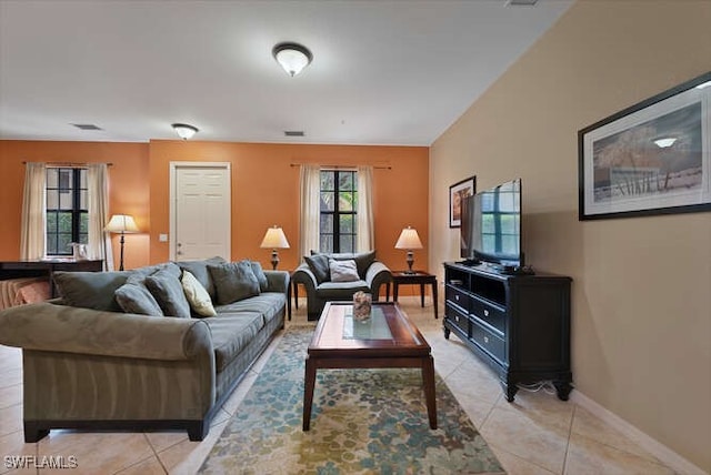 8945 Malibu St Unit 204, Naples, FL 34113 - living room featuring light tile patterned flooring and baseboards