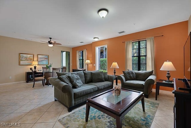 8945 Malibu St Unit 204, Naples, FL 34113 - living area featuring light tile patterned flooring, a ceiling fan, visible vents, and baseboards