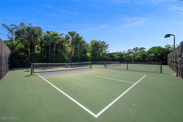 8945 Malibu St Unit 204, Naples, FL 34113 - view of tennis court with fence and community basketball court