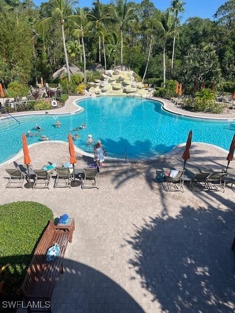 8945 Malibu St Unit 204, Naples, FL 34113 - pool with a patio