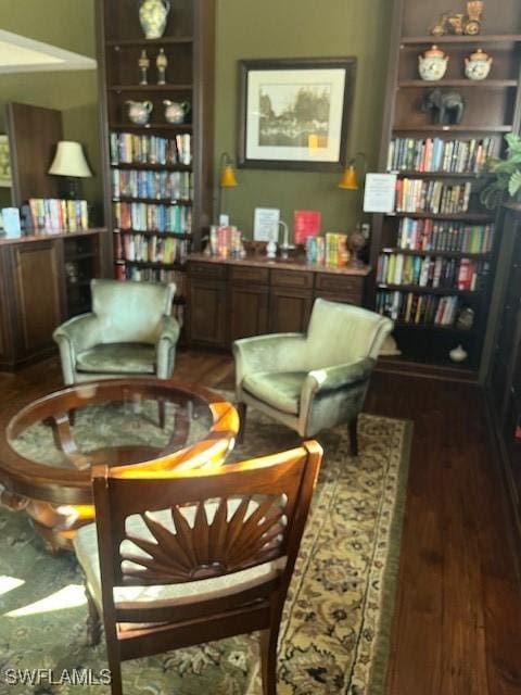 8945 Malibu St Unit 204, Naples, FL 34113 - sitting room featuring wood finished floors
