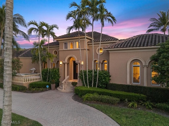550 21st Ave S, Naples, FL 34102 - mediterranean / spanish home featuring stucco siding and a tile roof