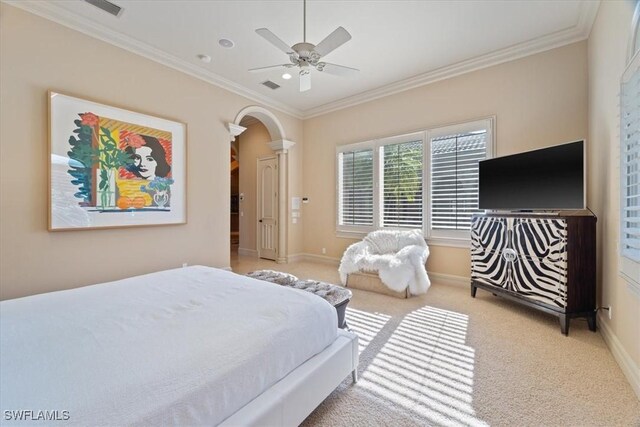 550 21st Ave S, Naples, FL 34102 - bedroom featuring carpet, baseboards, ornamental molding, and arched walkways