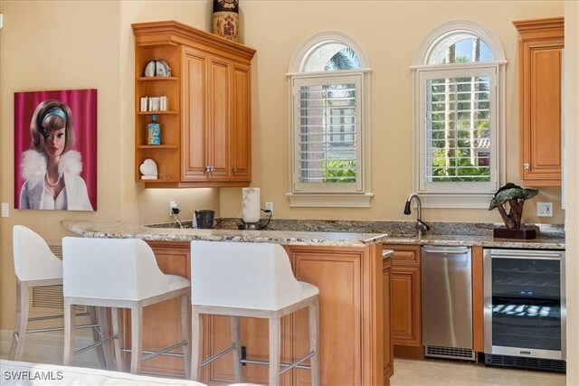 550 21st Ave S, Naples, FL 34102 - bar featuring a sink, wine cooler, and plenty of natural light