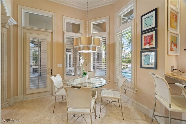550 21st Ave S, Naples, FL 34102 - dining room with baseboards, ornamental molding, and light tile patterned floors