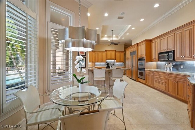 550 21st Ave S, Naples, FL 34102 - dining room featuring a ceiling fan, a tray ceiling, visible vents, ornamental molding, and recessed lighting