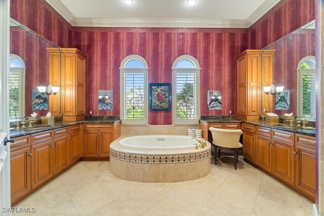 550 21st Ave S, Naples, FL 34102 - bathroom with crown molding, vanity, and a garden tub