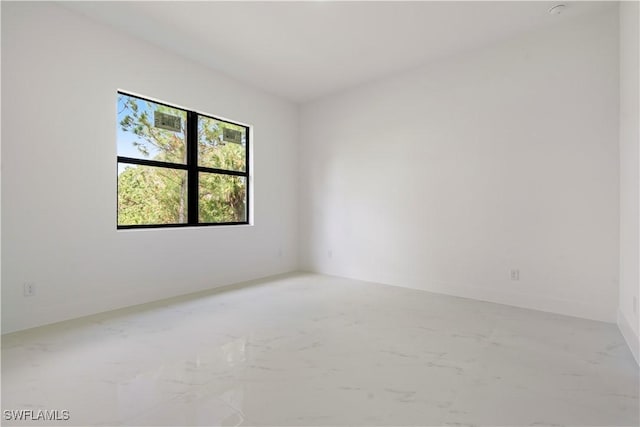 empty room featuring marble finish floor