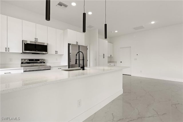 kitchen with visible vents, white cabinets, marble finish floor, stainless steel appliances, and recessed lighting