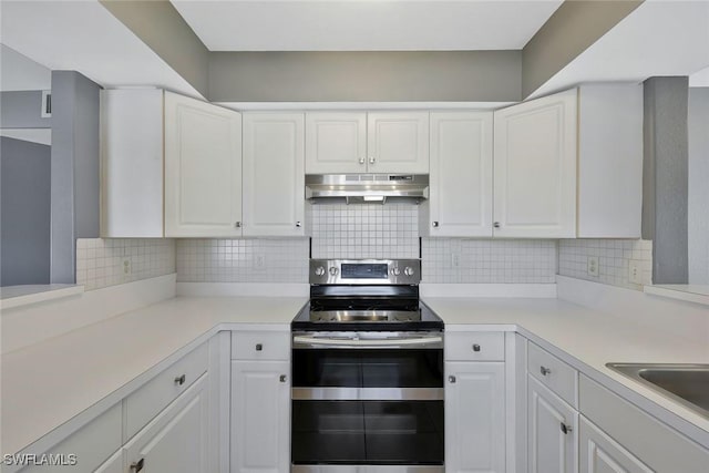 26672 Little John Ct Unit 85, Bonita Springs, FL 34135 - kitchen featuring double oven range, range hood, and white cabinetry