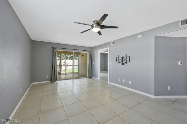 26672 Little John Ct Unit 85, Bonita Springs, FL 34135 - unfurnished room with a ceiling fan, light tile patterned floors, baseboards, and a smoke detector