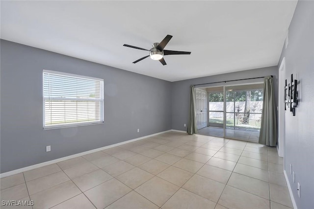 26672 Little John Ct Unit 85, Bonita Springs, FL 34135 - spare room with a ceiling fan, baseboards, and light tile patterned floors